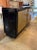 This Period Black Lacquered Art Deco Style Cabinet with Gold Leaf Doors is a stunning piece of furniture that exudes...