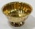 Vintage fluted brass bowl on pedestal base. Features scalloped rim and polished interior. Patina to brass.