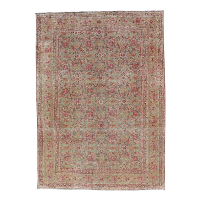Antique Persian Tabriz Rug With All-Over Design in Light Green, Pink, and Red For Sale