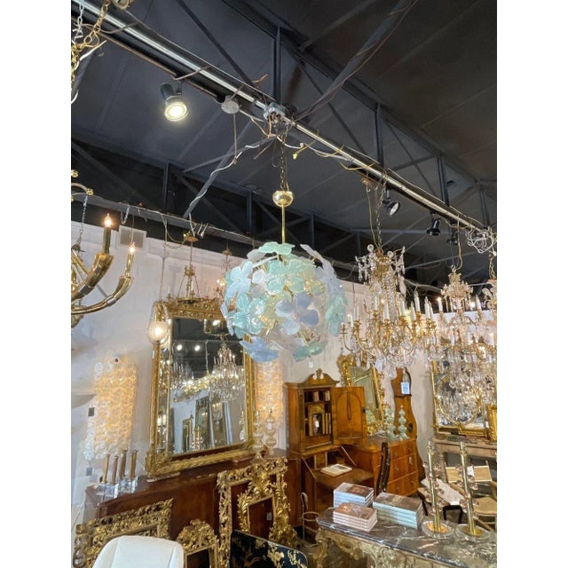 Beautiful modern Murano glass green and grey flower globe chandelier. Circa 2000. The chandelier has been professionally...
