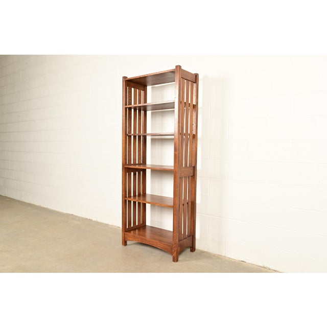 An exceptional Mission or Arts & Crafts quarter sawn oak tall bookcase By Stickley USA, Circa Late 20th Century Measures:...