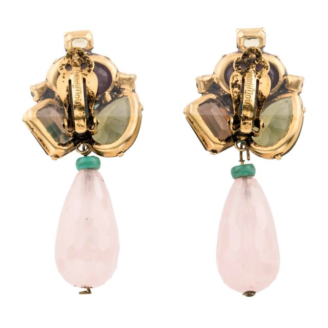 Iradj Moini earrings featuring floral design with colored stones and a crystal drop statement clip-on earrings a central...