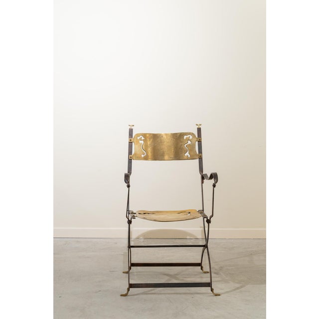 A sculptural, Brutalist-style folding chair by David Marshall (1942-present), a designer and artist known for his...