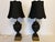 The bodies of these Basalt lamps are crafted from black Basalt, a fine grained, unglazed stoneware fabricated by Josiah...