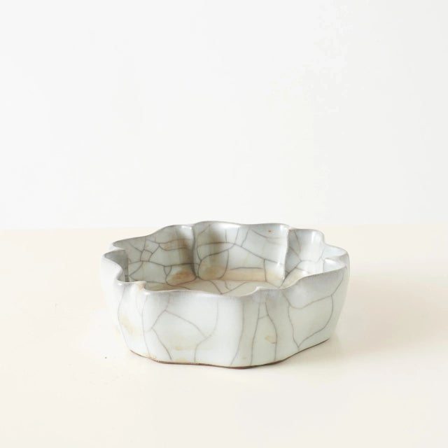 Guan Ware Style Brush Washer Porcelain brush washer with a lobed rim and milky green crackled glaze. The glaze thins at...