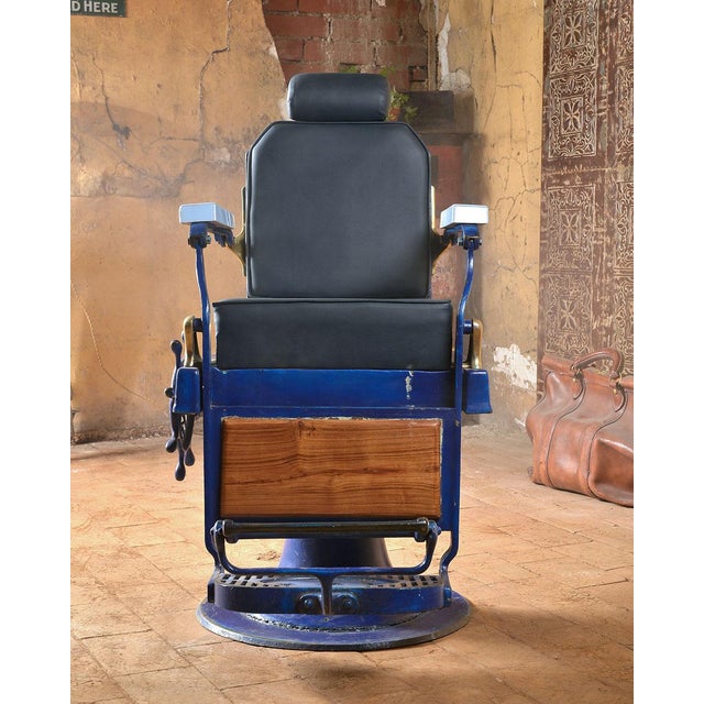 Magnificent old blue barber's chair. This piece is designed in the style of the selected designer and/or manufacturer