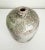 Beautiful, large ceramic raku vase featuring off-white and black crazing with a drip accent glaze in a celery green around...