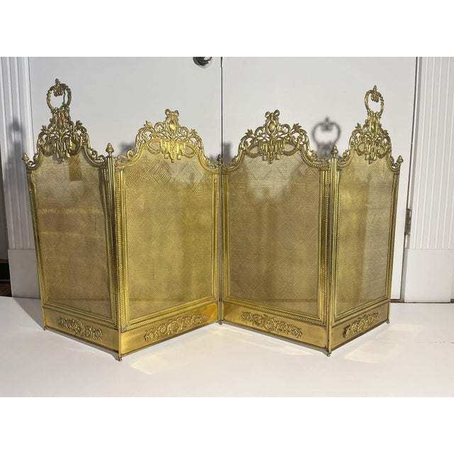 French style four-panel 19th century antique brass fireplace screen. These screens were used not only for screening fires...