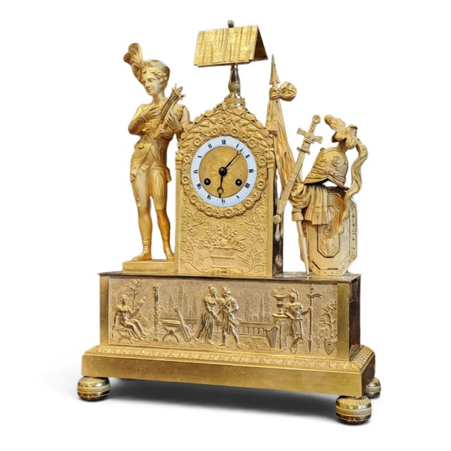 Parisian-style table clock from the Empire period (circa 1810-1815), in mercury-gilt bronze (ormolu) with a double patina...