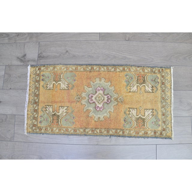 This is a vintage Turkish Oushak rug from the 1960s. The piece was hand-knotted.