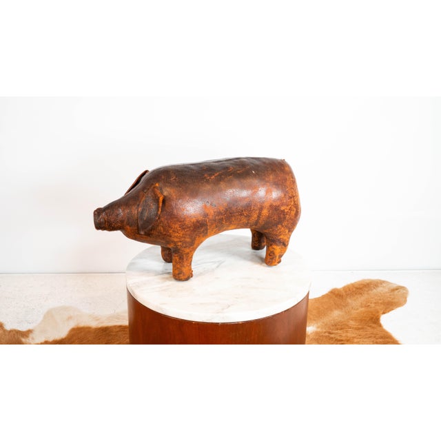 Vintage Dimitri Omersa for Abercrombie & Fitch stitched leather pig footstool, circa 1970s. Lovely aged patina to the...