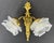 A decorative Vintage French pair of wall sconces , each featuring a twin-arm design with flower-shaped glass shades and an...
