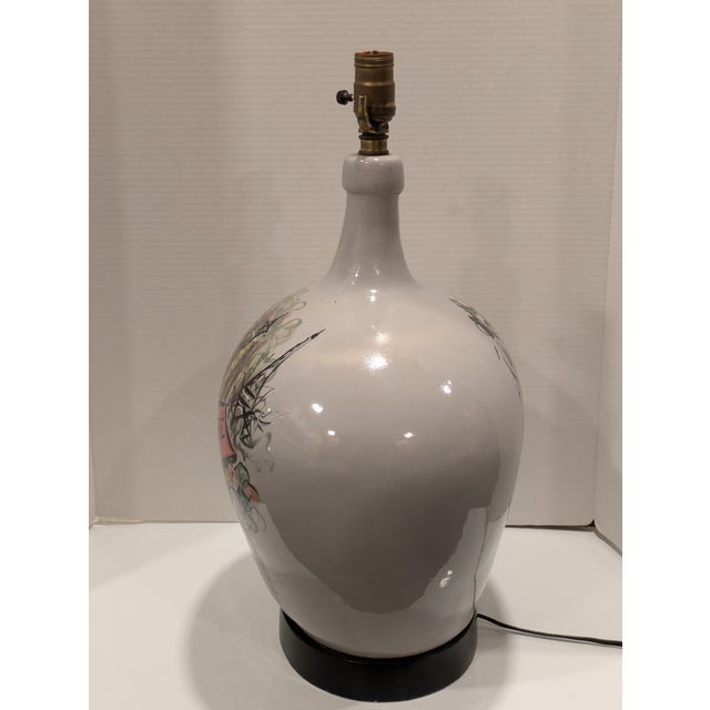 This large pottery lamp with a Paris Cafe and Eiffel Tower theme appears to have been made in the 1950s or early 60s. this...