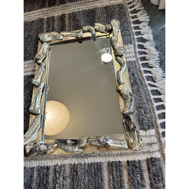 Vintage silver-leafed mirror made of bone-like driftwood. Absolutely stunning and would be excellent in a bathroom or...