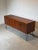 Authentic mid-century modern sideboard produced by G-Plan , crafted in richly grained teak wood and raised on elegant...