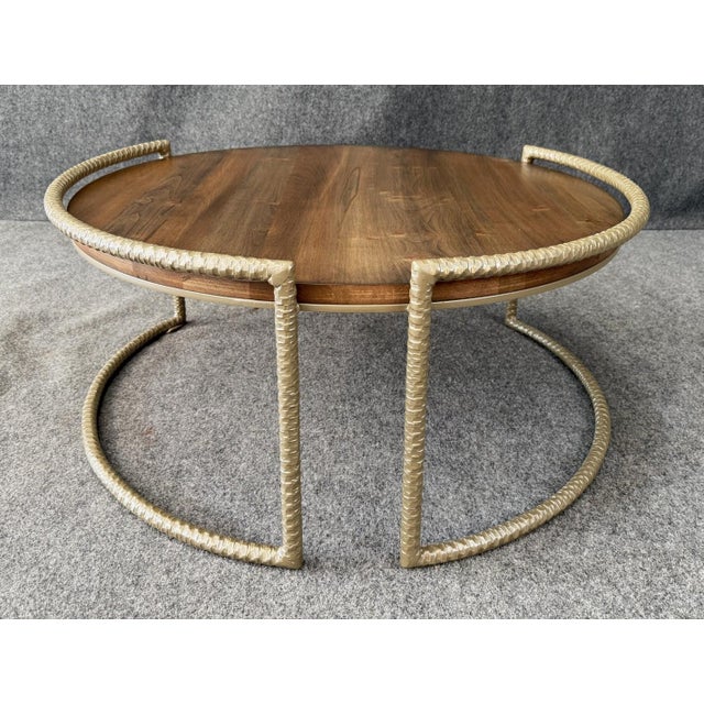 This Charleston Forge Spa Round Cocktail Table features a wood top framed by a sculptural metal base with a distinctive...