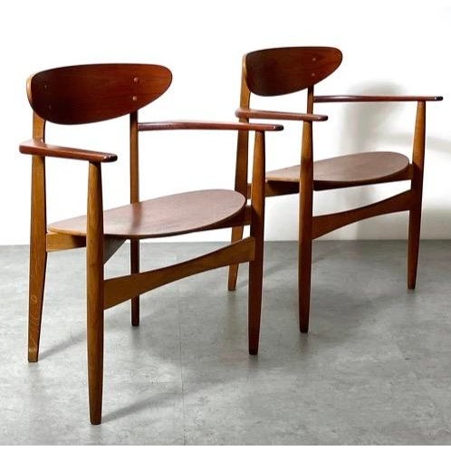 This is a vintage Pair of Teak Armchairs by Arne Hovmand Olsen circa 1950s. Molded teak plywood seat and back set in oak...