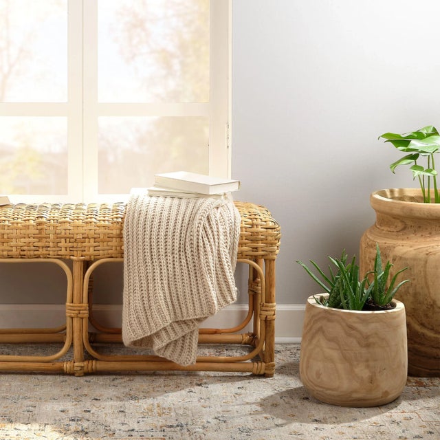 This vase is a beautiful way to display faux or real florals. Hand-carved from solid wood with a natural finish, allowing...