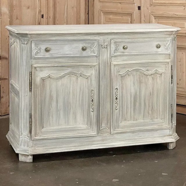 19th Century Country French Whitewashed Oak Buffet is a study in understated elegance! The spacious top features fine...