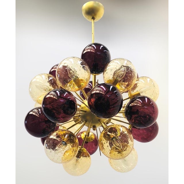 Italian sputnik chandelier with amber and amethyst Murano glass globes carefully hand blown with bubbles inside the glass...