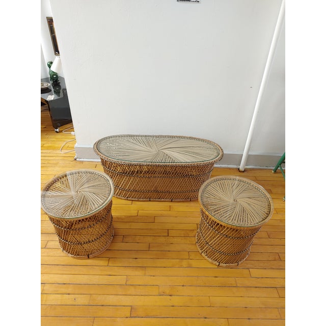 Here's a nice set of rattan tables for the patio or sun room in the style of Franco Albini. Each has a glass top. Great...