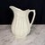 Antique English ironstone pitcher by Royal Staffordshire Pottery, Wilkinson Ltd., featuring a beautifully molded form with...