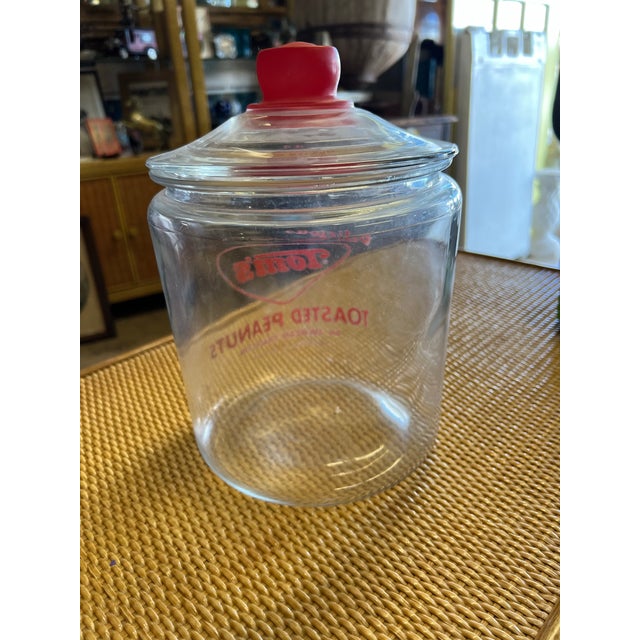 Vintage Tom’s Toasted Peanuts Clear Glass Jar - Red Handled Lid-Counter Display. Estimate age 1950 . This was used as a...