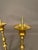 Pair of 19th-century French Gothic style bronze candelabra dating to circa 1890, featuring intricate cast cherub motifs...