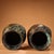 A handsome pair of Chinese bronze jars, decorated with intricate gold inlay (错金, "cuojin") scrollwork and inscriptions...