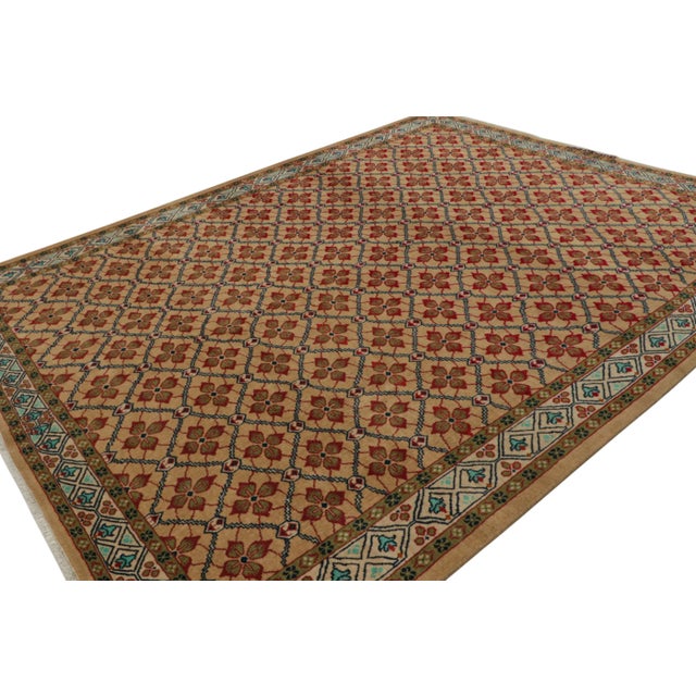 Hand Knotted in wool, this vintage 9x11 Turkish rug, circa 1970-1980, features lattice field design with geometric-floral...