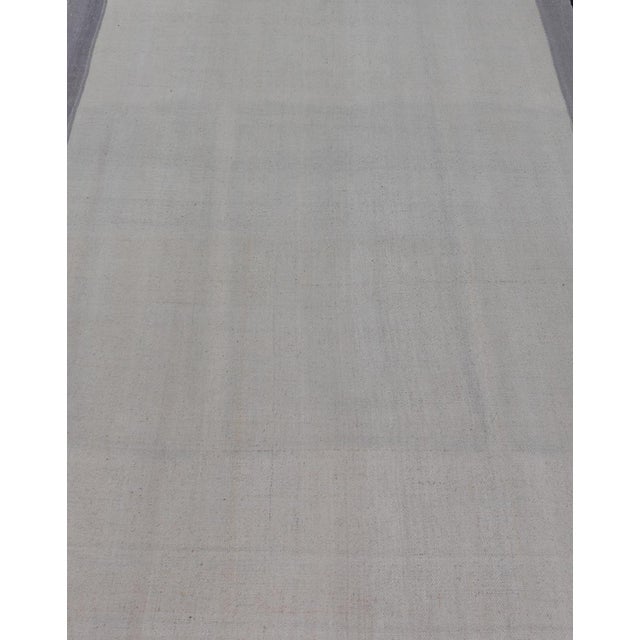 Measures: 4'10 x 7'1 Vintage Turkish Kilim Rug with White Field and Light Lavender Border. Keivan Woven Arts /...