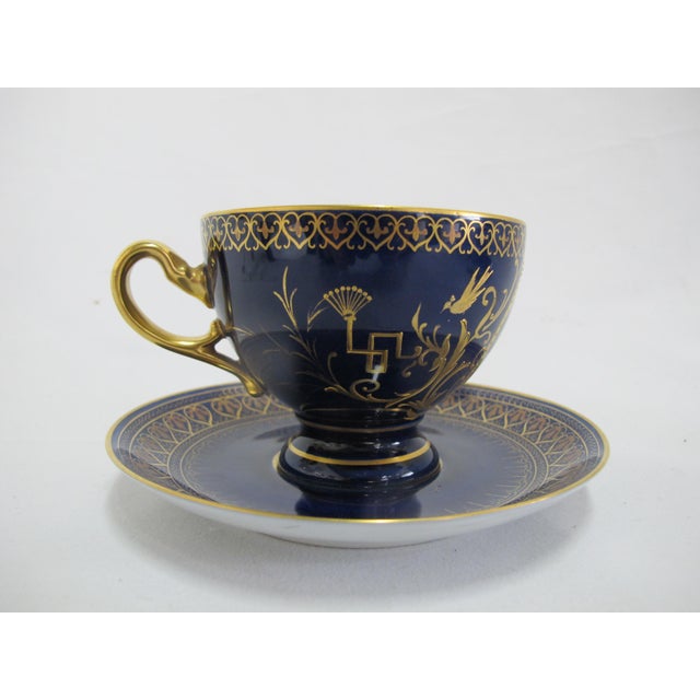 19th century, Karlsbad Hermann Voigt, Bohemia porcelain cup and saucer. Cobalt blue with ornate gilt accents and finely...