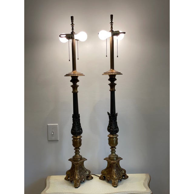 A pair of Monumental Baroque Lamps with beautiful ormolu detail. Nicely contrasting metals for a sophisticated presence.