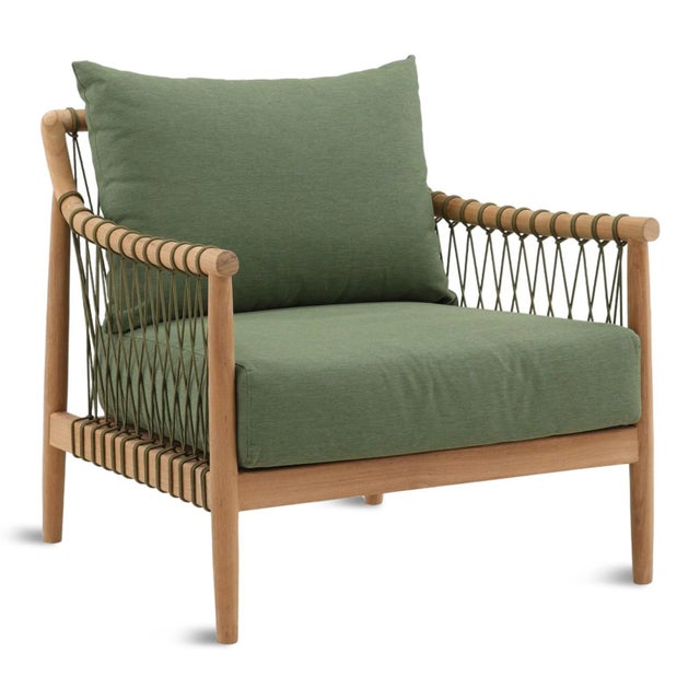 Teak frame outdoor arm chair with soft fern green canvas cushions. Matching green smooth rope criss-crossed and tied from...