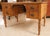 French Provincial pine four-drawer desk, kneehole style with nicely turned legs. Later drawer pulls.