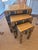 A three piece nesting table made of wood. This nesting table has a lacquer finish which makes things easy to clean. The...