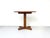 Round, very well-maintained teak dining table with a cross-shaped base. The entire construction is made of solid teak. The...