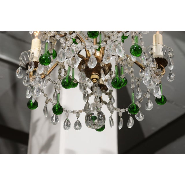 The petite 5-light chandelier has a beautifully patina'd gold leaf iron frame. Traditional Italian macaroni crystal beads...