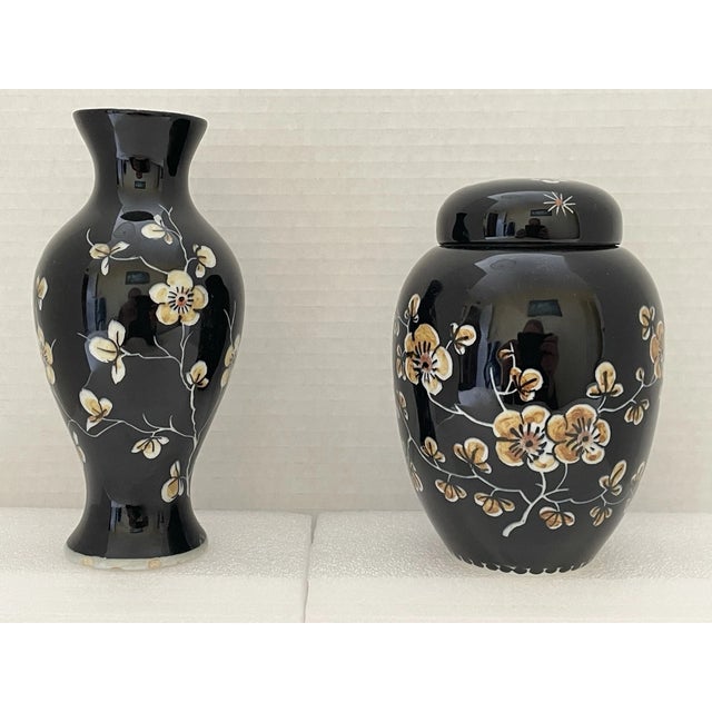 Elegant and richly detailed, this vintage 1960s Royal Delft “Famille Noire” set features a stunning lidded ginger jar...