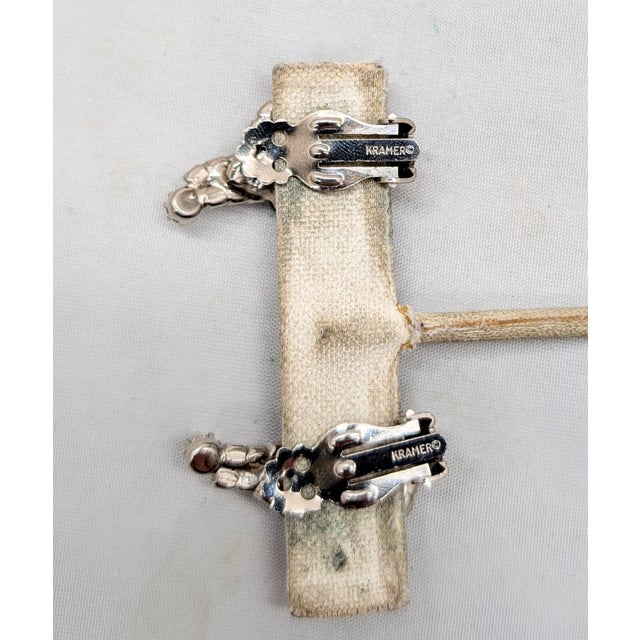 Vintage 1960s Signed Kramer Rhodium Plated Faux-Emerald & Clear Rhinestone Clip Earrings-2 Pieces For Sale In Philadelphia - Image 6 of 6