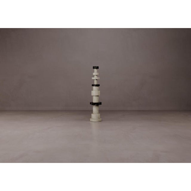 Totem Sculptures in Acid-treated Ostuni Travertine by Dainelli Studio Atelier Dimensions: W 40 x D 40 x H 188 cm...