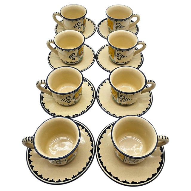 A vintage set of eight coffee cups and saucers in the “Casolare” pattern by Corso dei Fiori, hand painted in Italian...