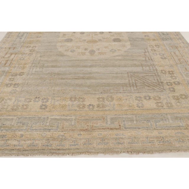 This oversized 10x14 contemporary Khotan rug is a breathtaking addition to Rug & Kilim’s Modern Classics collection—a...