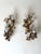 An exceptionally delicate and decorative pair of italian two-light wall sconces, dating approximately from the 1930s to...