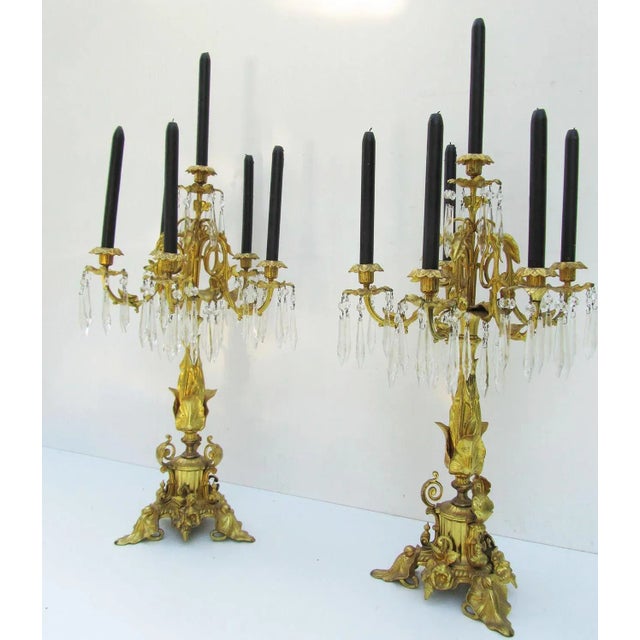 - Gilt bronze candlesticks, early 1800s standing on tripod bases - It is possible to unscrew the candlesticks from the...
