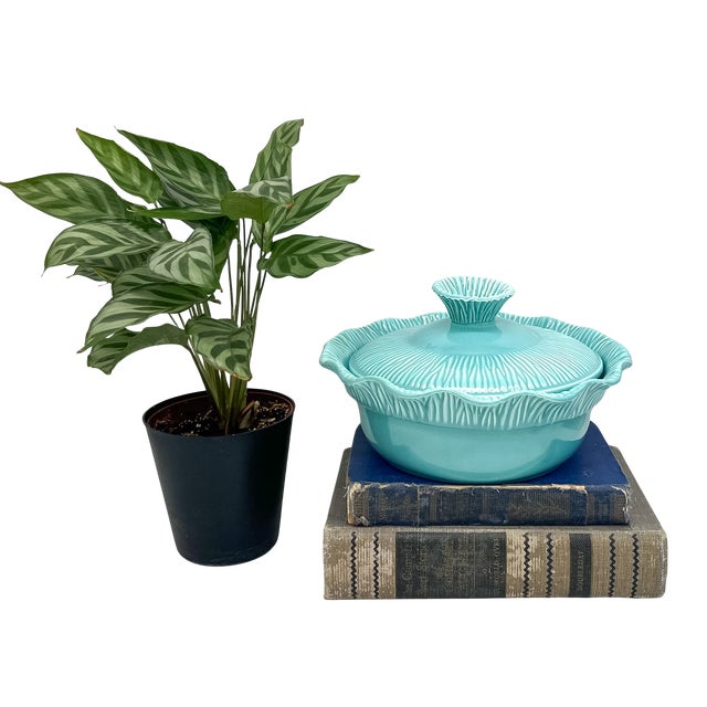 Striking 1956 covered serving bowl by Miramar of California in a vibrant aqua glaze. The design features a softly...