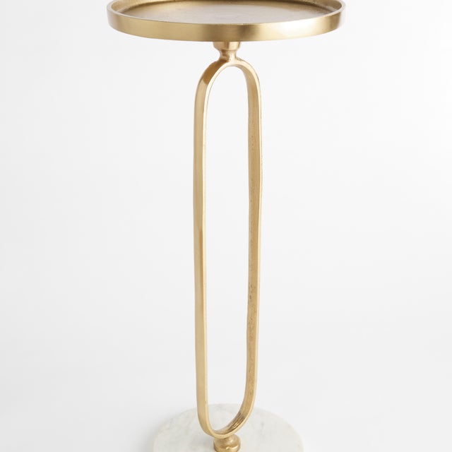 A simple mix ofWhite marble and brass creates a sophisticated look. A petite design, with a modern silhouette, this...