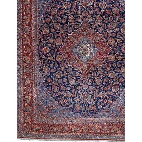 ACTUAL SIZE: 10’5″ x 13’9″ PRIMARY COLOR: Navy / Red AGE: Old MATERIALS: Wool FOUNDATION: Cotton PRODUCTION: Handwoven,...