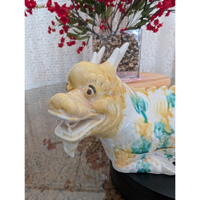 This vessel bears the face of a dragon — a guardian of skies and spirit. In East Asian tradition, dragons are protectors...