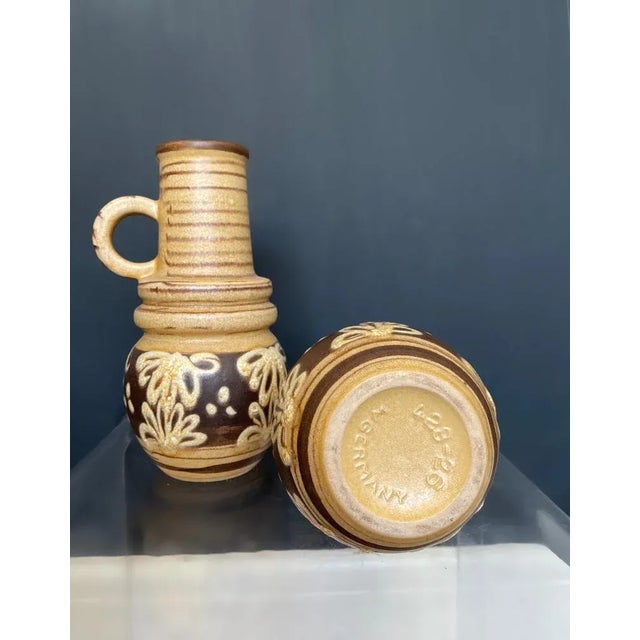 Vintage mid century modern handled vases by German company Scheurich-Keramik. They are glazed in brown & beige and...